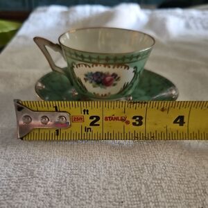 Elegant Green Floral Teacup and Saucer Set